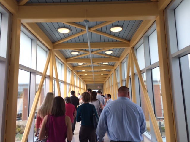 A skybridge links the two sides of the school across the courtyard